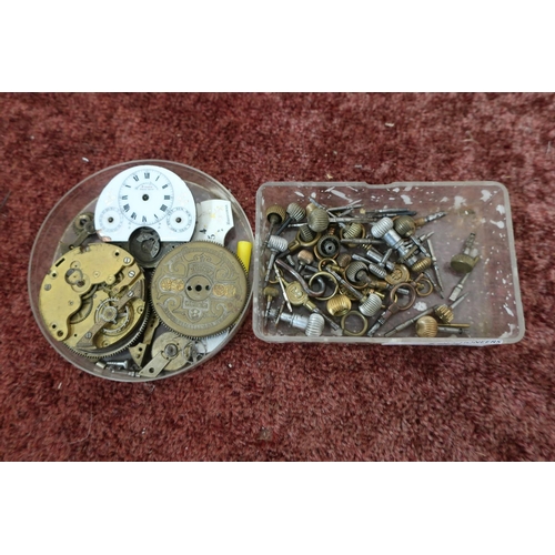 163 - Two Hebdomas pocket watch movements and a small selection of pocket watch winding crowns