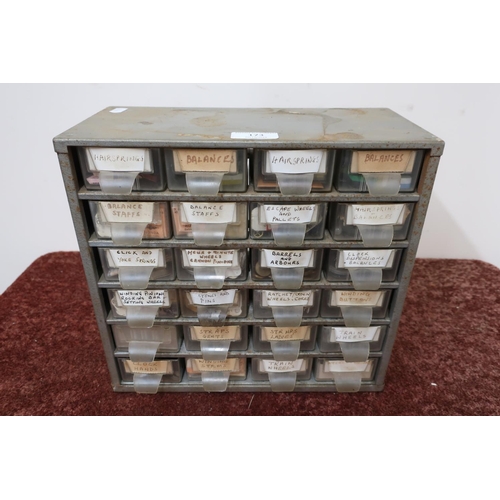 173 - Metal engineering drawer of 24 drawers containing main springs, balances, escape wheels and other it... 