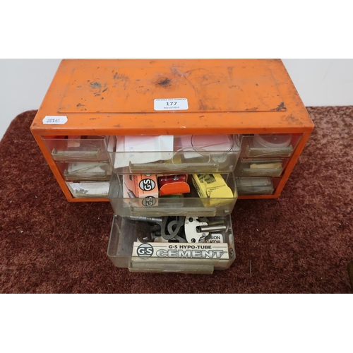 177 - Small 9 drawer plastic chest containing pocket watch crystals, setting cement, watch keys etc