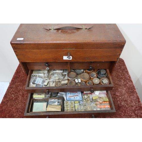 184 - Watch makers mahogany chest containing mainsprings, case screws, case winding crowns etc