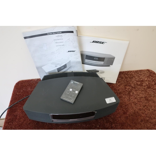 21 - Bose wave radio/CD player with instruction manual, remote control etc