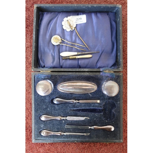 229 - Cased hallmarked silver manicure set, two Mother of Pearl hatpins etc