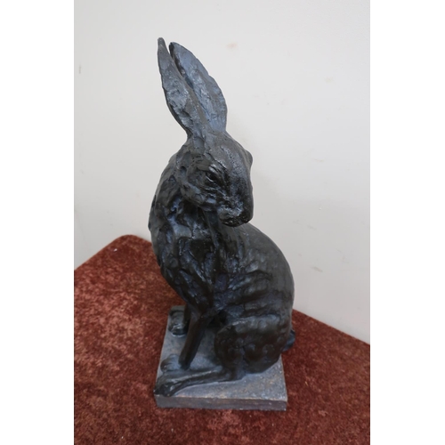 28 - Seated composite figure of a hare (47cm high)