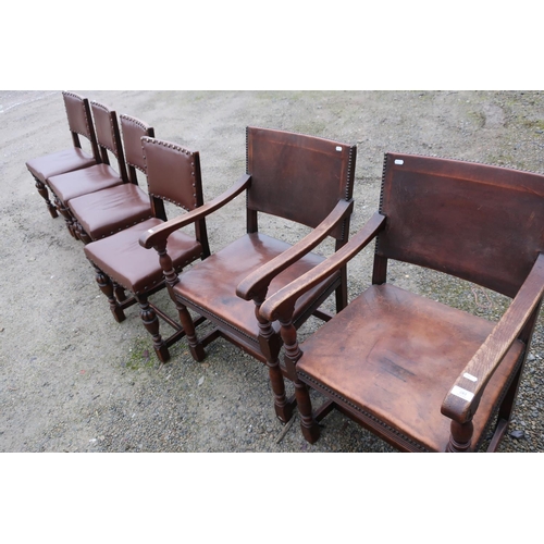 283 - Pair of oak framed arm chairs with leather upholstered seats and backs on turned supports