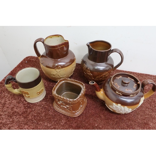 299 - Five pieces of stoneware, including Doulton Lambeth jugs, Royal Doulton stoneware teapot, salt glaze... 