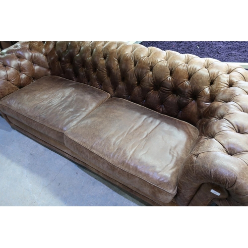 327 - Large Victorian style brown two seat Chesterfield leather sofa with two large cushions and deep butt... 