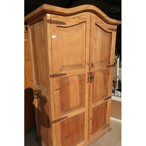 334 - Rustic pine double door wardrobe with wrought metal straps and arched top (118cm x 61cm x 192cm)