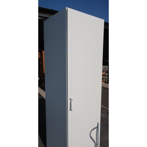 376 - Large cream laminate cupboard enclosed by a single door with various interior shelves (60cm x 60cm x... 