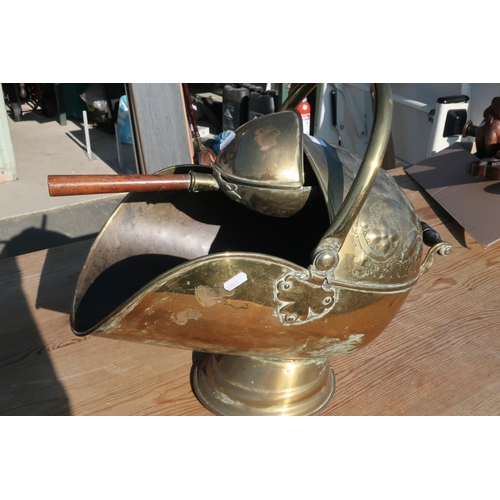 385 - Brass fire helmet and shovel with turned wood handle