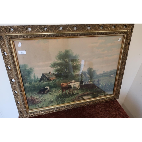 392 - Gilt framed coloured print of cattle at waters edge by W J Hulk (82cm x 62cm including frame)