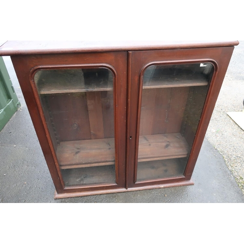 438 - Late Victorian mahogany bookcase enclosed by two glazed cupboard doors with later stained pine top (... 