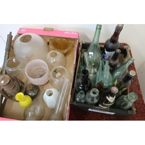 448 - Selection of various assorted glass light shades and oil lamp chimneys, and a selection of glass bot... 