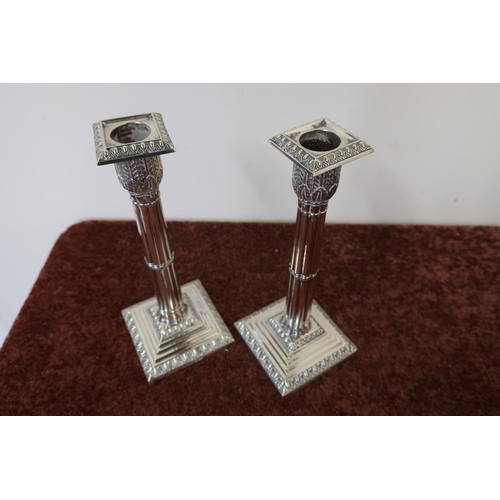 460 - Pair of quality silver plated candlesticks on stepped weighted bases and fluted columns by Walker & ... 