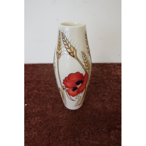 468 - Moorcroft poppy pattern vase (21cm high)