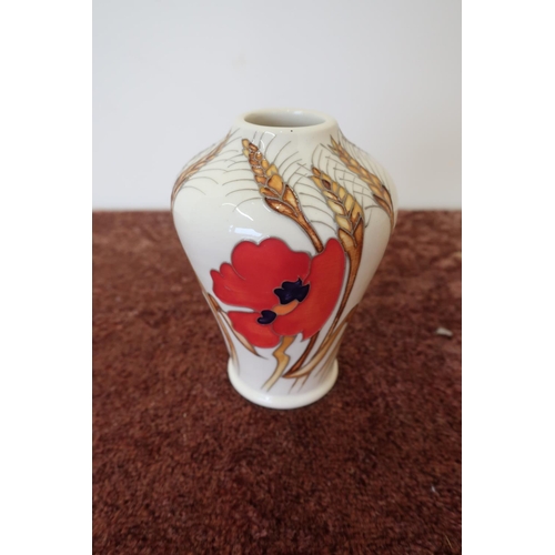 472 - Moorcroft poppy pattern vase (11cm high)