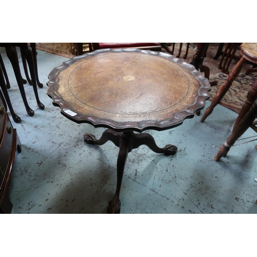 139 - Small mahogany tilt top table with leather insert top and three out-splayed supports with ball & cla... 