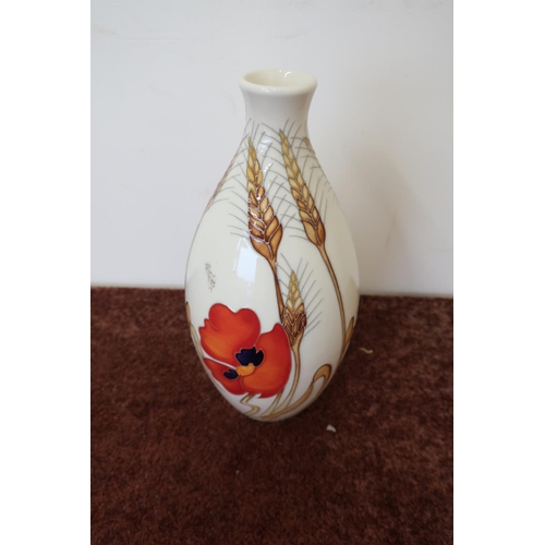 22 - Moorcroft poppy pattern vase with swollen body (24cm high)