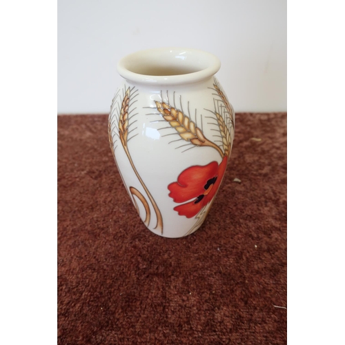 23 - Moorcroft poppy pattern vase (13cm high)
