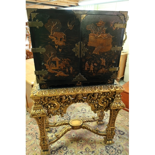 107 - 19th C Chinoiserie cabinet on stand, lift off cabinet enclosed by two panelled doors with brass meta... 