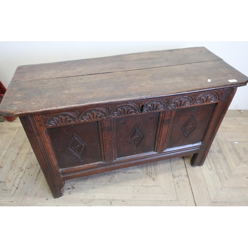 102 - 18th C oak coffer with twin planked lift up top and carved and panelled detail to the front and side... 