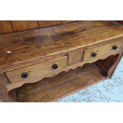 104 - 19th C rustic country style pine dresser with three tier raised back with planked detail above two d... 