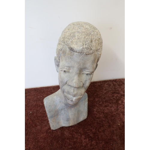 121 - Carved African stone bust of a male (32cm high)