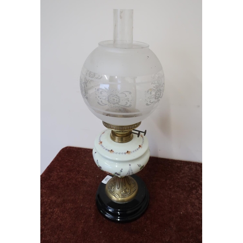 122 - Edwardian oil lamp with opaque glass reservoir on turned circular base (55cm high)