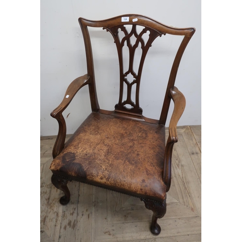 134 - Mahogany framed wide seated armchair on cabriole supports and leather upholstered seat