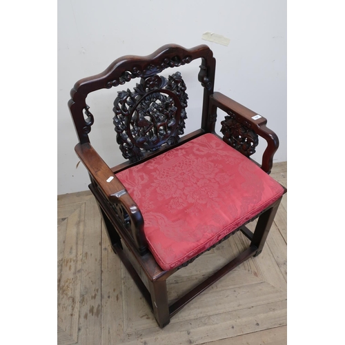 137 - Carved Chinese hardwood armchair with broad seat, elaborately carved back and arm supports, with loo... 