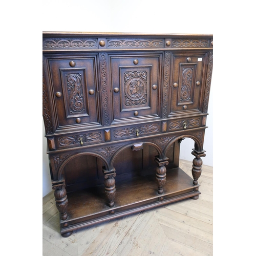 139 - Quality carved oak court style cupboard with three upper carved and panelled doors above three drawe... 