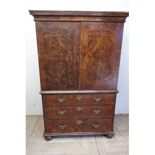 142 - 18th C burr walnut chest on chest with stepped cornice above two panelled cupboard doors with cross ... 