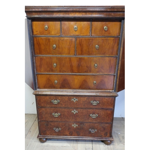 142 - 18th C burr walnut chest on chest with stepped cornice above two panelled cupboard doors with cross ... 