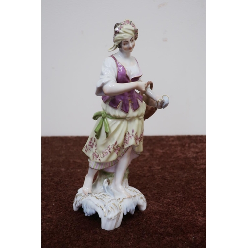 150 - KPM porcelain figure of a lady carrying a basket (height 22cm)