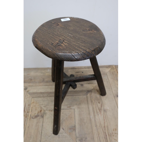 182 - Interesting 19th C primitive three legged elm stool with circular top and interconnecting cross stre... 