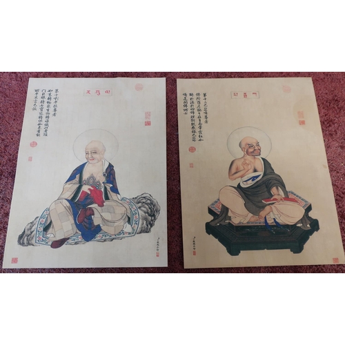 201 - Two unframed oriental prints on parchment of seated figures with various text (21cm x 28cm) (2)