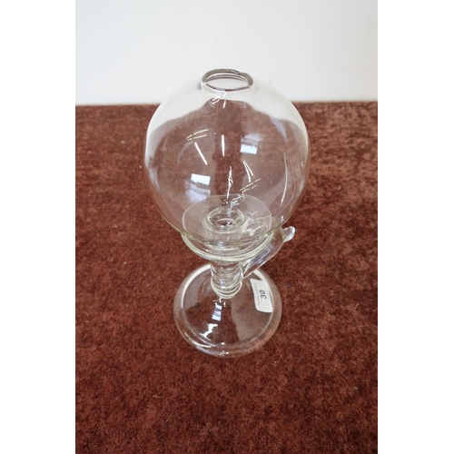 30 - 19th C glass lace makers oil lamp with circular base, loop handle, and globe (approx height 25cm)