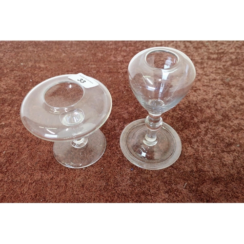 33 - Two 19th C glass oil lamps with circular bases (heights 10cm and 15cm) (2)