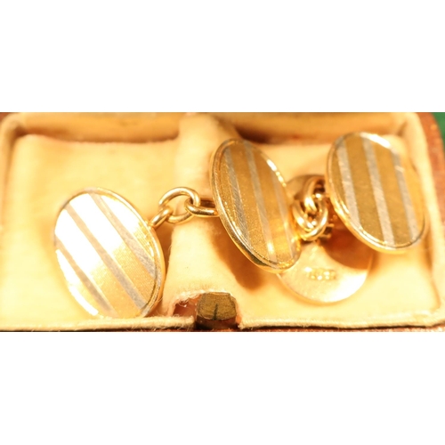 366 - Pair of 18ct gold chain link oval cuff-links in two tone gold with engine turn detail