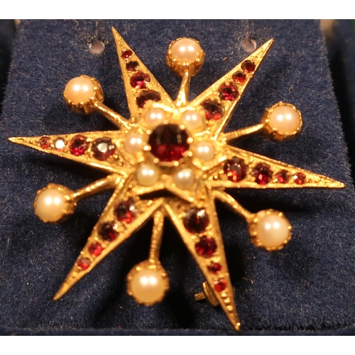 376 - Unmarked yellow metal seed pearl and garnet star shaped bar brooch