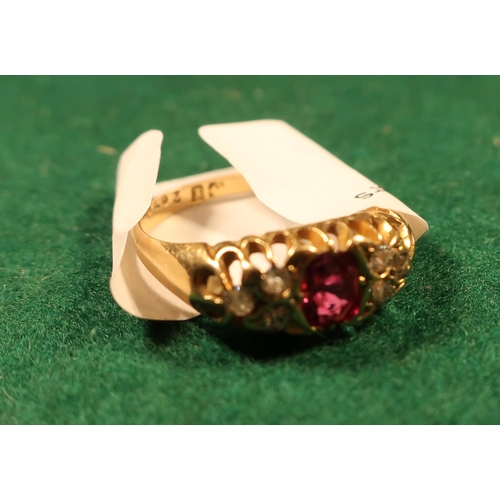 377 - 18ct gold ruby and diamond ring with central oval stone flanked by three diamonds to each shoulder (... 