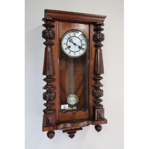 88 - Walnut cased wall clock, the white enamel dial marked Junghams