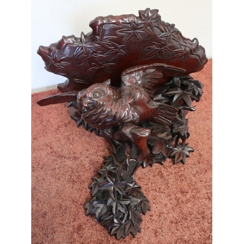 65 - Carved mahogany wall bracket supported by a carved figure of an owl within foliage (approx 34cm x 40... 