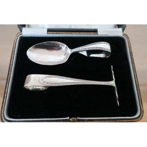 394 - Cased Birmingham 1924 silver hallmarked baby's push and spoon set