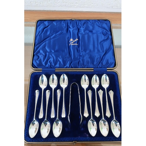 397 - Cased set of silver hallmarked teaspoons and sugar tongs comprising of a set of six Sheffield silver... 