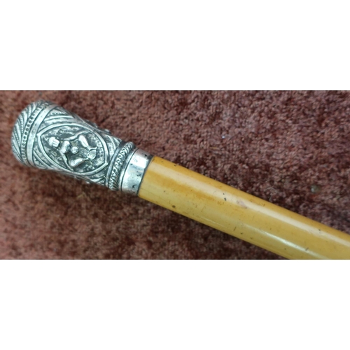 406 - Victorian Malacca walking cane with Indian white metal top embossed with various figures (overall le... 