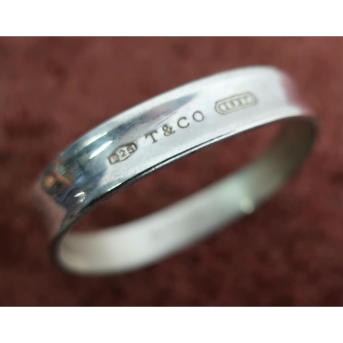 414 - Boxed Tiffany and Co silver hallmarked bangle stamped 2003 Tiffany and Co 925 to the inside and furt... 