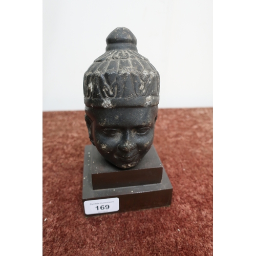 169 - Carved hardstone far Eastern deity bust mounted on stepped square base (height 19cm)