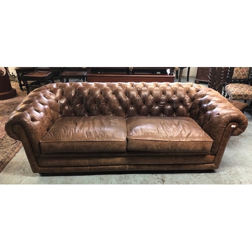 93 - Large Victorian style brown two seat Chesterfield leather sofa with two large cushions and deep butt... 