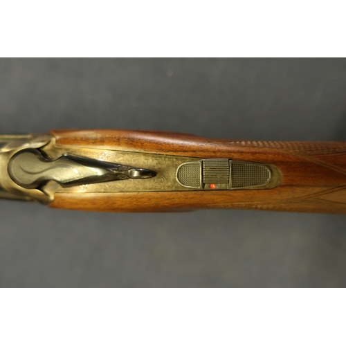 598 - Cased Rottweil 28 bore over and under ejector shotgun with 30 inch barrels, multi chokes, with singl... 
