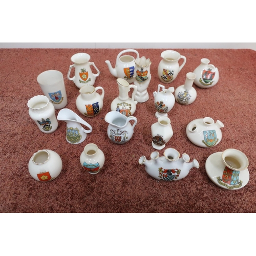 115 - Approximately fifty pieces of souvenir crested china some by Arcadian and Carlton china